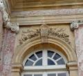 French pilaster capitals and a window.